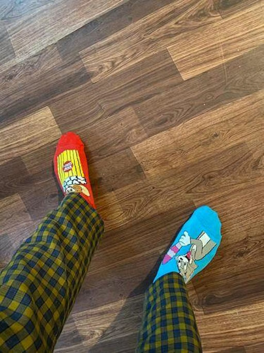 Customer wearing mismatched Jumplings Tom and Jerry socks